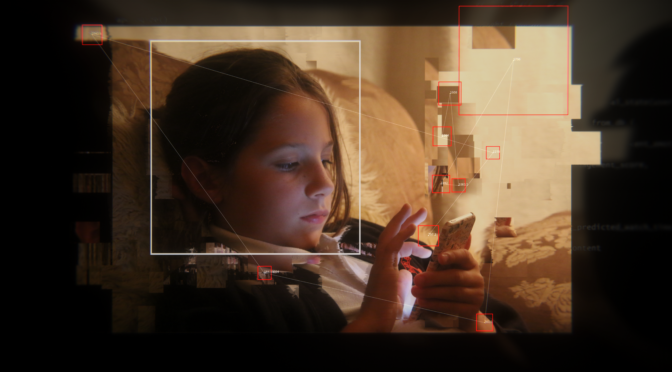 still from Molly vs The Machines showing a little girl looking at a phone